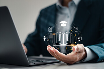 Online education concept, Businessman using and holding E-learning education icons for internet lessons and online webinar. Education internet technology.