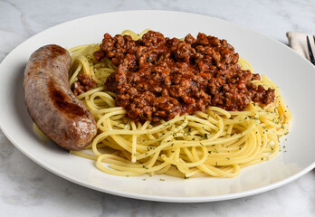 spaghetti served with hamburg sauce  and italian sausage