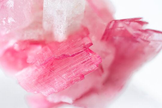 macro close up of natural rubellite (pink tourmaline) mineral cristals on white background