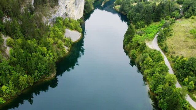 Drone shot of lake bay surrounded with woods and hills in Zaovine, Serbia