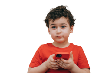 Cute caucasian little boy holding phone isolated transparent background, amazed by new games, apps. Children leisure activities, entertainment. Handsome American toddler enjoying new gadget.