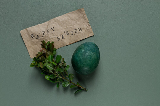 easter card, green egg, boxwood branch, typewritten text , happy easter, - Powered by Adobe