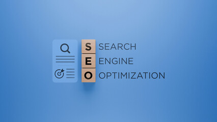 Wooden blocks with SEO acronym, magnifying glass and refresh icon, search engine optimization...
