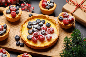 Christmas cupcakes adorned with berries