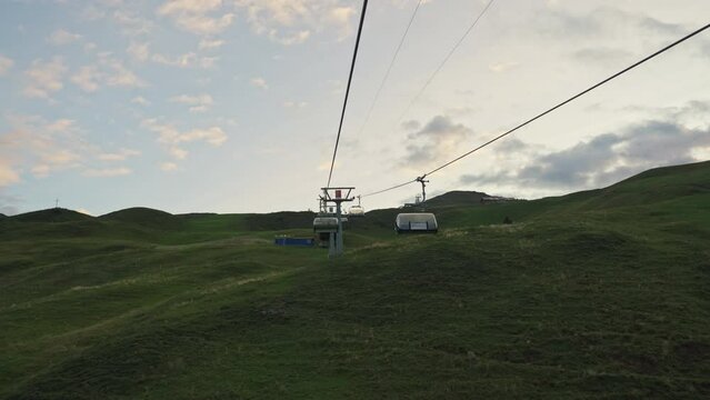 Chairlift or cable car riding over Stoos village and mountain landscape at Schwyz, Switzerland