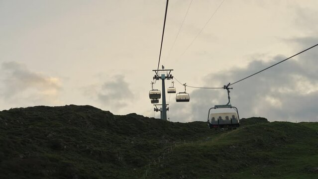 Chairlift or cable car riding over Stoos village and mountain landscape at Schwyz, Switzerland