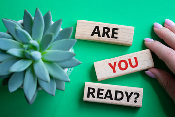 Are you ready symbol. Concept word Are you ready on wooden blocks. Businessman hand. Beautiful...