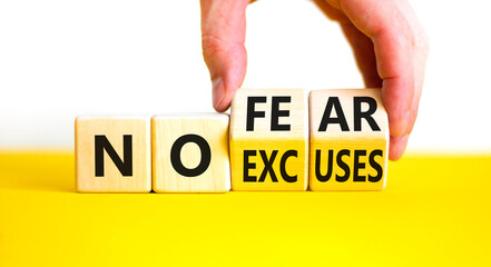 No fear and excuses symbol. Concept words No fear No excuses on wooden block. Beautiful yellow...