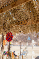 A dream catcher against the backdrop of the desert and mountains in Egypt