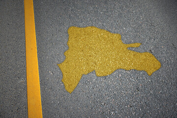yellow map of dominican republic country on asphalt road near yellow line.