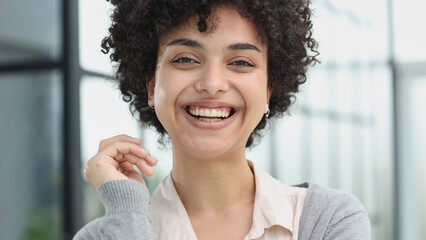 girl in the office smiles expresses success and leadership is thinking about success