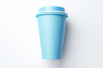 A blue cup with a white lid is placed on a white surface. This versatile image can be used for various purposes.
