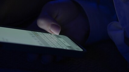 Text message with mobile phone. Woman texting sms with smartphone. Catfish or digital scam. Screen keyboard in instant messaging chat. Macro close up of finger writing.