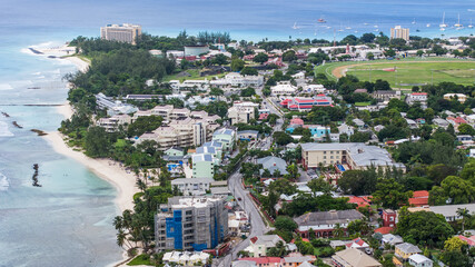 aerial landscape view of a costal area in the parish of Christ Church located in the south part of Bridgetown, Barbados with white sand beaches and turquoise water as well Drill Hall Beach in back - obrazy, fototapety, plakaty