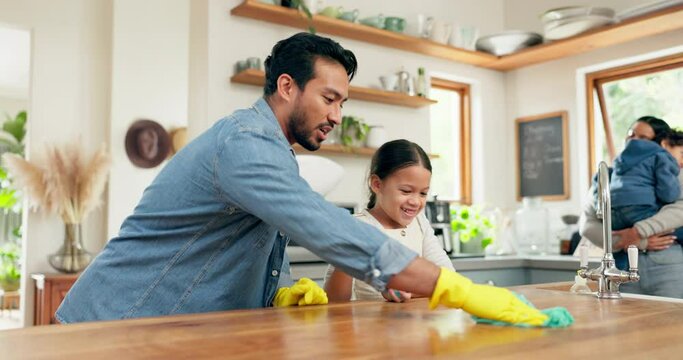Father, daughter and spray table for cleaning, cloth or happy for learning, helping hand or funny in home. Parents, kids and hygiene in family house with bonding, love or teaching in kitchen together