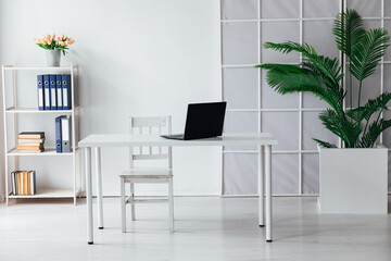 An office space with a laptop on the table