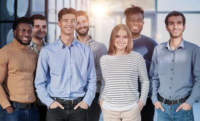 Successful business team smiling while standing in the office
