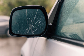 Cracked Car Side Mirror - Automotive Repair and Safety Concept