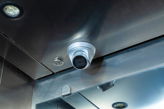 Dome security camera in the public elevator in the business center