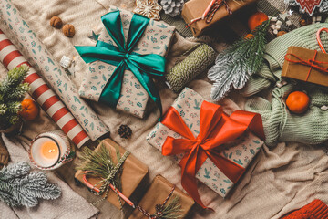 Fototapeta na wymiar Christmas gifts top view in a festive atmosphere