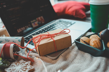 Christmas gift box on laptop