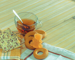 Tea drink in a large bowl and some sweets