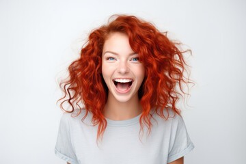 Joyful Redhead With Radiant And Lively Spirit On The Background Of White Wall. Сoncept Vibrant Redhead, White Wall Backdrop, Radiant Spirit, Lively Personality