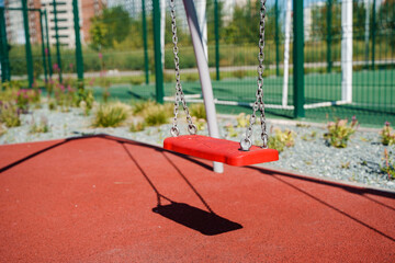 Swing on chains on the playground