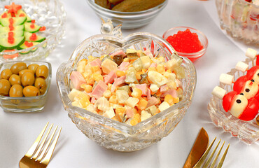 Christmas New Year dishes, traditional Olivier salad and a variety of vegetable snacks, concept for festive serving and New Year's Eve, menu for a restaurant