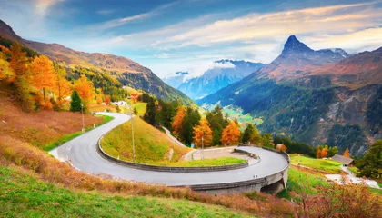 Foto auf Acrylglas Alpen wonderful nature landscape of switzerland vivid autumn scenery of maloja pass switzerland europe amazing serpentine road is a most popular place of travel and outdoor vacations in swiss alps