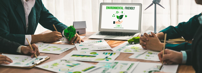 Business people in green corporate company planning eco-friendly and environmental conservative to...