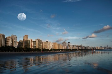 City of Santos, Brazil. Late afternoon on Santos beach with seaside buildings lit by the sun...