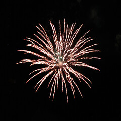 Circle explosion of real fireworks on black background for overlay blending mode.