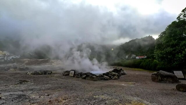 Geyser active showing the hot water and the fumes in Furnas, in the island of Sao Miguel in Azores, Portugal