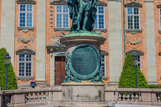 Close-up view of information desk under historic statue of Gustavo Erici in front of Riddarhuset (House of Nobility) in Stockholm, Sweden. 
