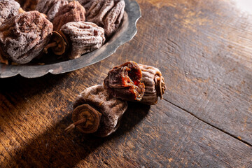 Dried persimmons on wooden table
