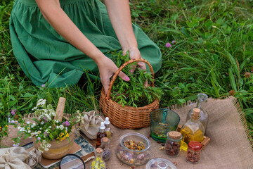 A woman makes herbal tincture. Selective focus.