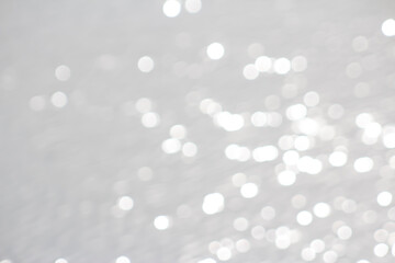 White & Pearlescent Sparkly Bokeh Like Water Background or Border