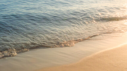 Fototapeta na wymiar Soft beautiful ocean wave on sandy beach. Background.