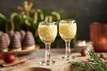 Eggnog with wasp nests or beehives - traditional Christmas cookies in the background