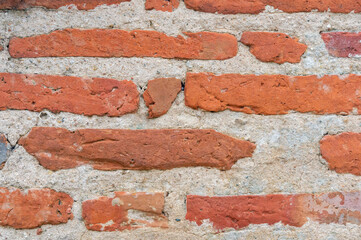 Old Urban Textures: Intriguing Detail of the Vintage Red Brick Wall.