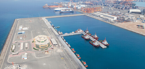 Jeddah Islamic Seaport aerial view with moored tugs