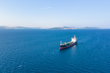 Fototapeta na wymiar Oil chemical tankers anchored near port of oil chemical plant, aerial drone shot