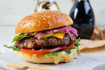 Delicious burger with beef meat, homemade bun and mayo