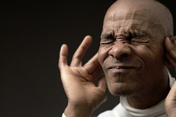 suffering from deafness and hearing loss on grey black background with people stock image stock...