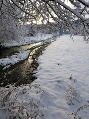 Silber river near egge tower in winter