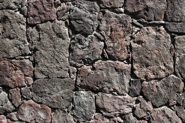 Mosaic stones wall pattern background. Mineral tile structure. Old architecture background. Medieval wall texture.