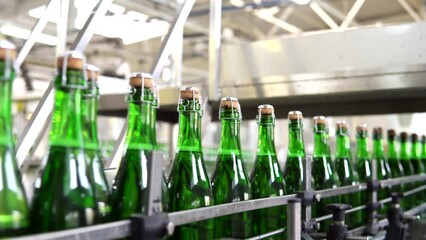 Industrial sparkling wine bottling plant theme. Modern industry production line for champagne alcohol drink bottling and packaging.