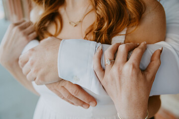 Couple hugging with wedding ring