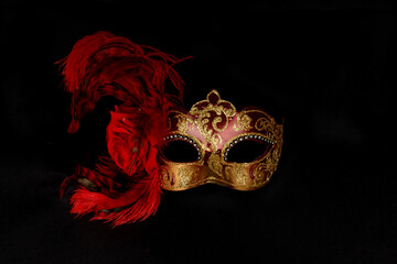 a nice carnival mask on a black background, concept of celebrating Christmas holidays, carnival,...